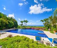 Expansive private swimming pool with stunning ocean views at Apples House holiday rental villa in Barbados