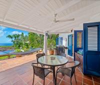 Outdoor entertaining terrace with hammock and barbecue at Apples House villa in Rock Dundo, Barbados