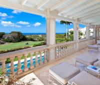 Spacious shared patio with plush seating, overlooking the Royal Westmoreland golf course and the Caribbean Sea.