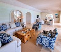 Spacious and beautifully designed living room at Howzat Villa, Royal Westmoreland, Barbados, with plush seating, high ceilings, and elegant decor.