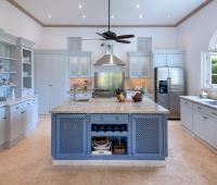 Fully-equipped kitchen with sleek cabinets, modern appliances, and a spacious island at Ixora, Royal Westmoreland, Barbados
