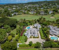 Aerial view of Ixora Royal Westmoreland, Barbados, highlighting the beautiful property, pool, and surrounding lush tropical landscaping