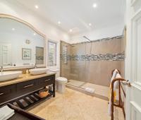 Spacious and luxurious master bathroom with modern shower and elegant design at Ixora, Royal Westmoreland, Barbados