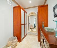 Walk-in master closet with elegant storage and natural light at Ixora, Royal Westmoreland, Barbados