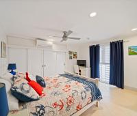 Second bedroom at Palm Beach 102 Barbados holiday condo with air conditioning and comfortable furnishings