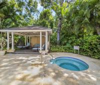 Gazebo and Jacuzzi area at Sandalwood House, Sandy Lane, surrounded by tropical greenery for a tranquil experience.