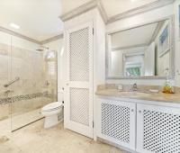 Spacious second bathroom in Seabreeze Penthouse, Sugar Hill Resort, Barbados, featuring a large walk-in shower, marble countertops, and stylish tile accents, combining luxury with convenience for a relaxing experience.