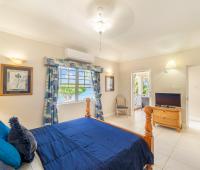 Barbados Beachfront Vacation Rental Villa Seawards Master Bedroom towards Patio with TV