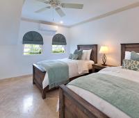 A spacious fourth bedroom at Sugar Cane Ridge 12, featuring twin beds, soft linens, and calming decor—ideal for children or extra guests.