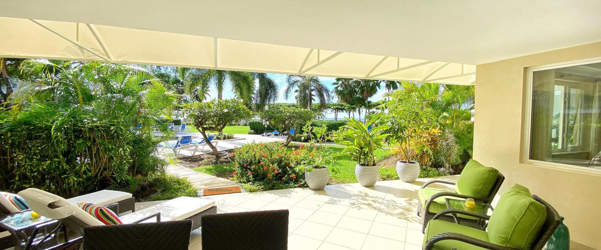 Palm Beach 211 Barbados Beachfront Vacation Condo Rental Covered Patio with Garden Views
