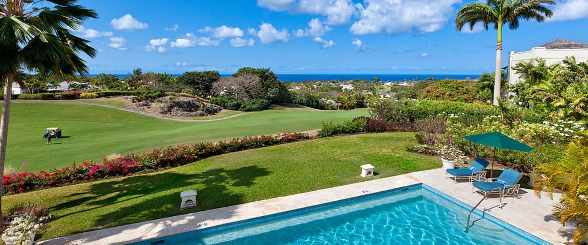 Expansive private pool with panoramic golf course and ocean views at Benjoli Breeze, Royal Westmoreland, Barbados.