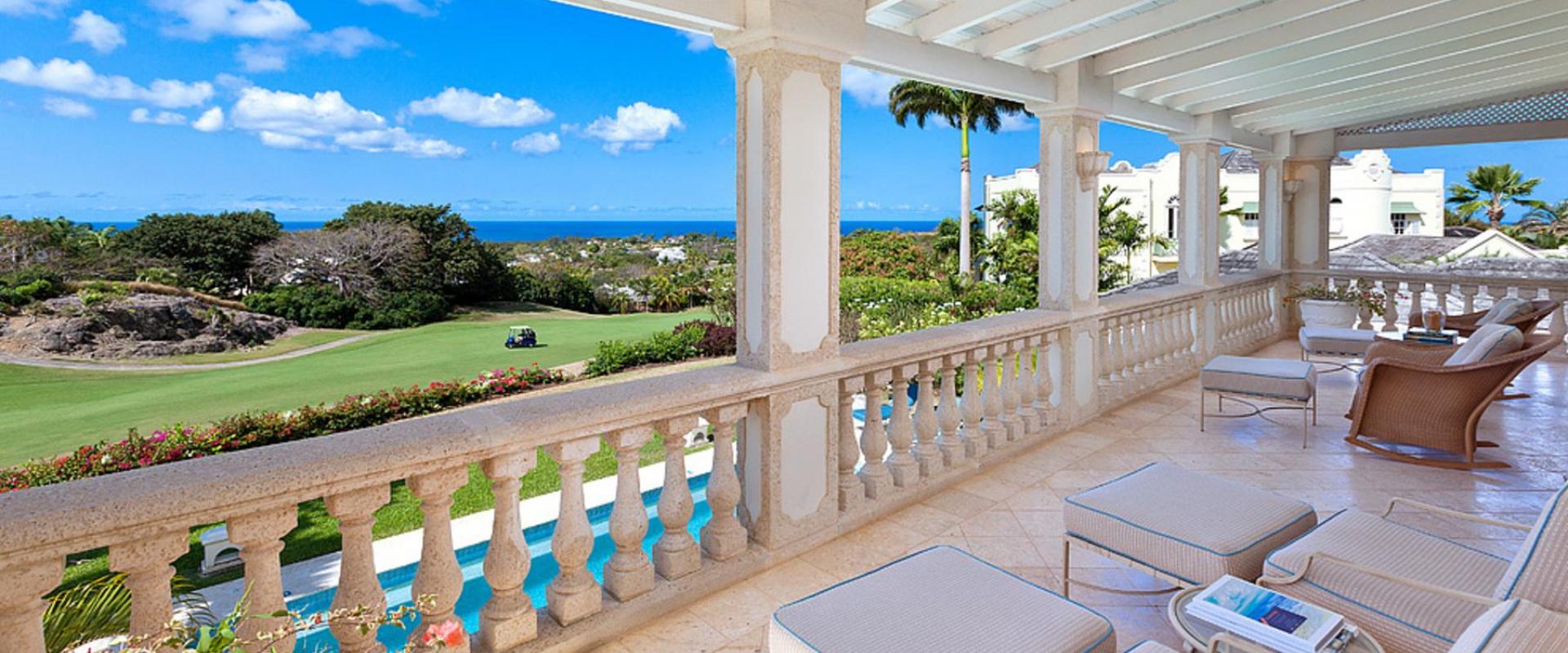 Spacious shared patio with plush seating, overlooking the Royal Westmoreland golf course and the Caribbean Sea.