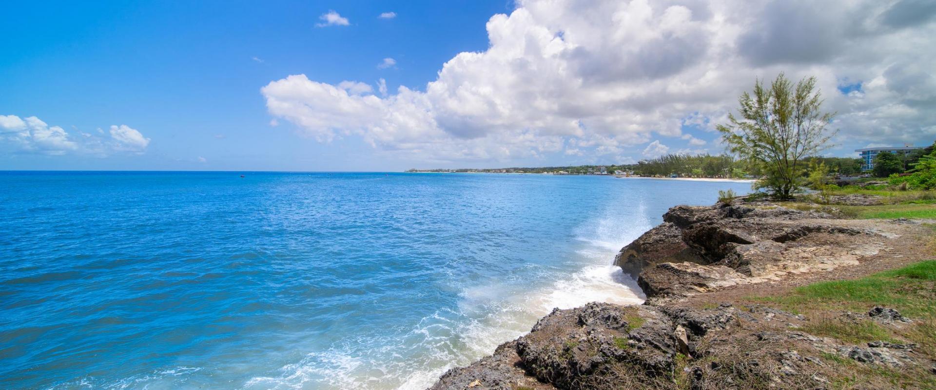 Gorgeous ocean view from the master suite patio at Blue Waters 1 holiday villa, showing rocky coastline and turquoise waters in Barbados.