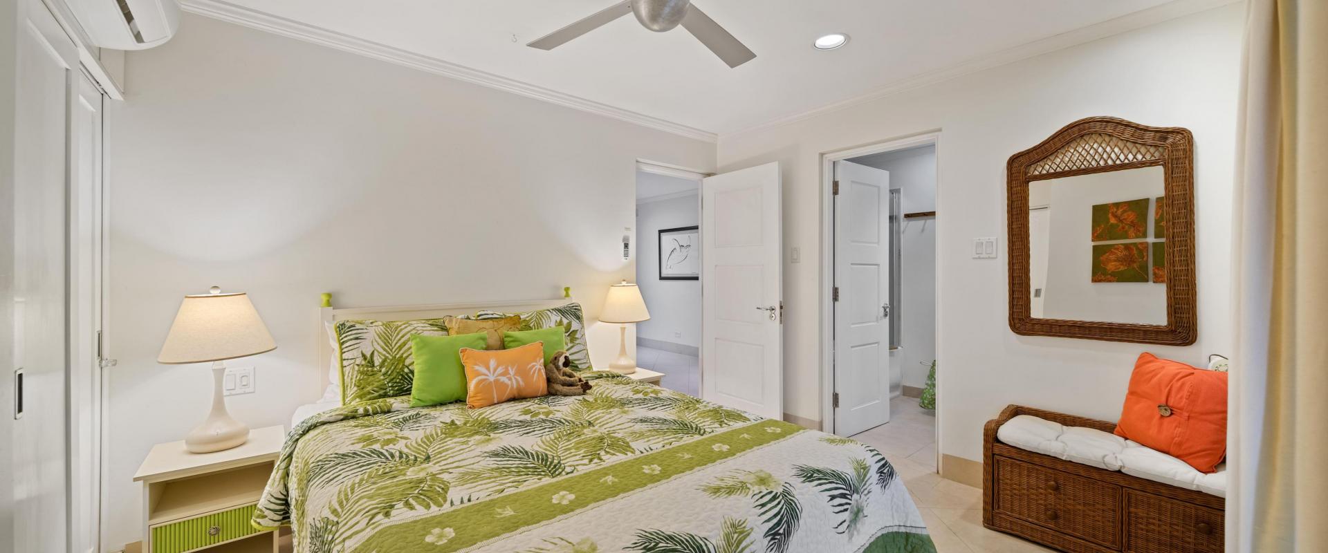 Palm Beach 102 Third Bedroom – Barbados Holiday Rental Third bedroom at Palm Beach 102 Barbados holiday rental with tropical bedding and ensuite access
