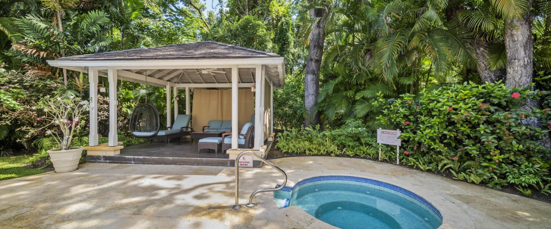 Gazebo and Jacuzzi area at Sandalwood House, Sandy Lane, surrounded by tropical greenery for a tranquil experience.