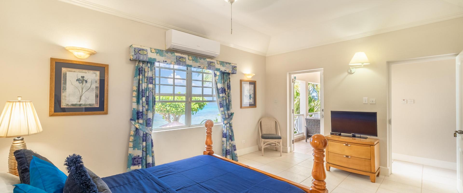 Barbados Beachfront Vacation Rental Villa Seawards Master Bedroom towards Patio with TV