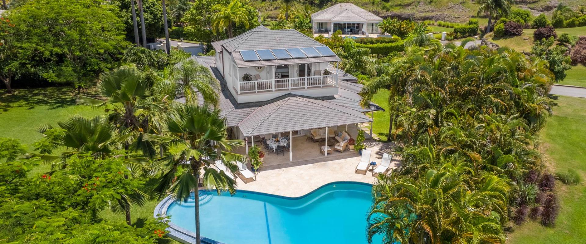 Breathtaking aerial view of Villa Rosa, showcasing its lush gardens, private pool, and Royal Westmoreland surroundings.