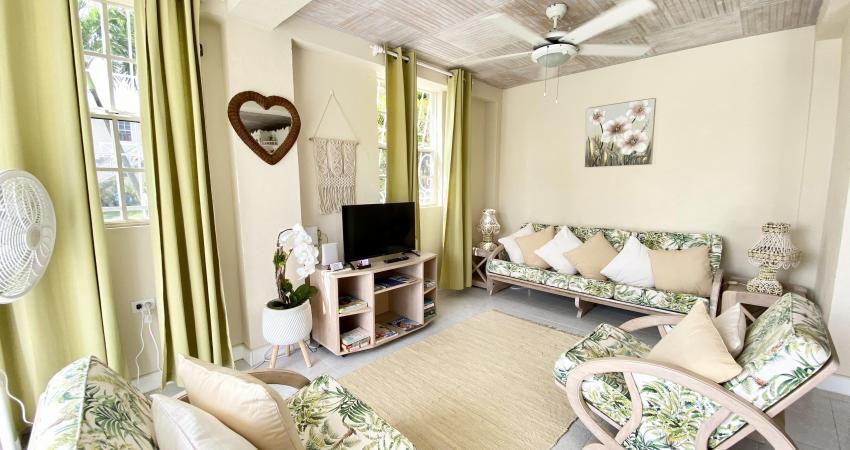 Heywoods 145 Barbados Vacation Rental Apartment Living Room with Seating and TV